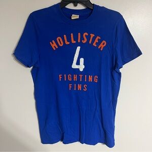 Hollister Men’s T-shirt Embroidered #4 “Fighting Fins” Size‎ Medium Blue
